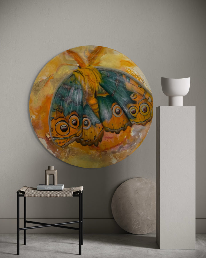 Round abstract painting of butterflies on a wall with minimal decor.